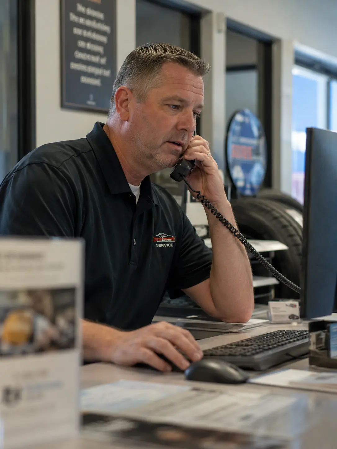 Service advisor at a dealership on the phone