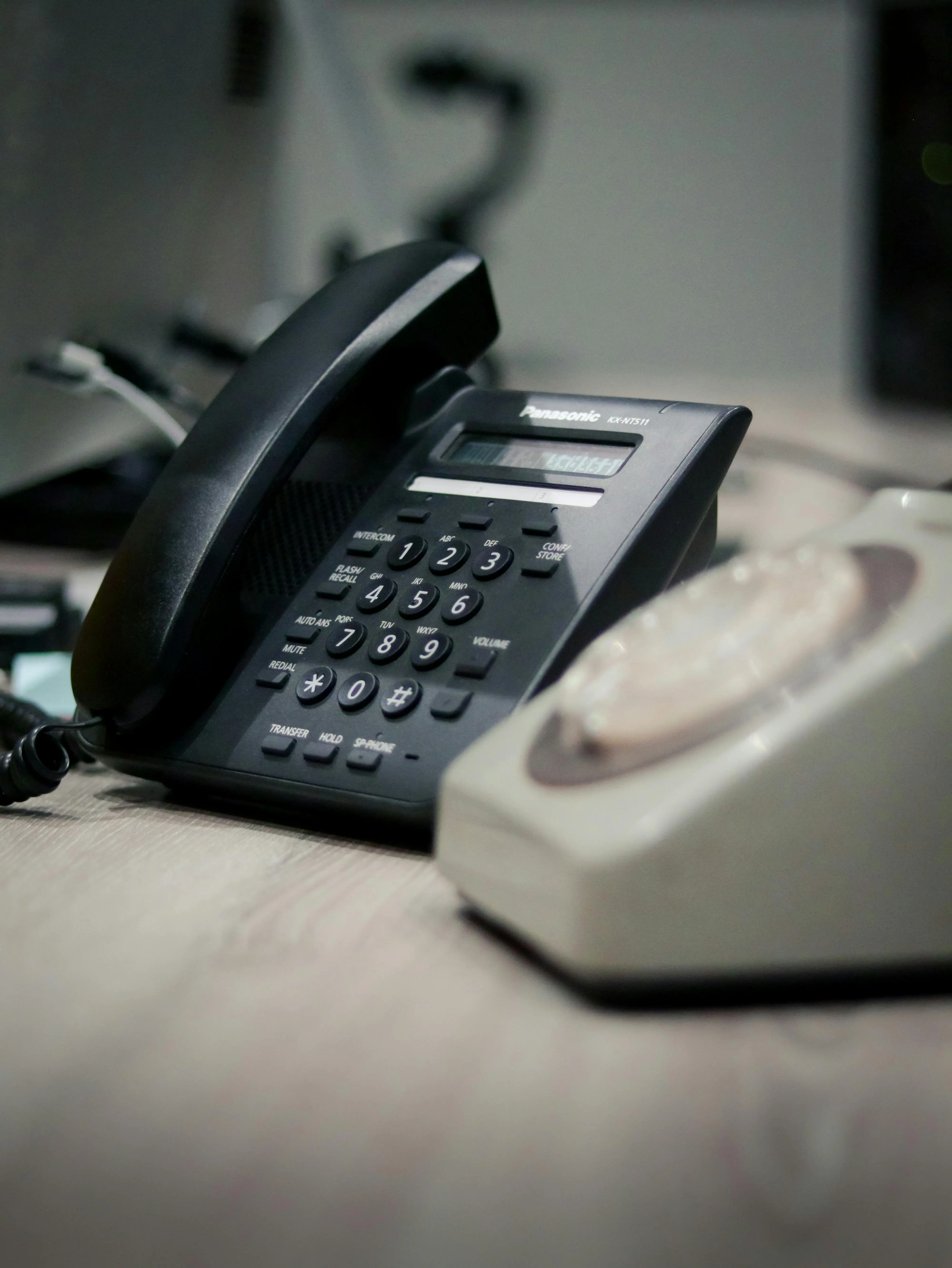 A dealership phone sitting on a service desk